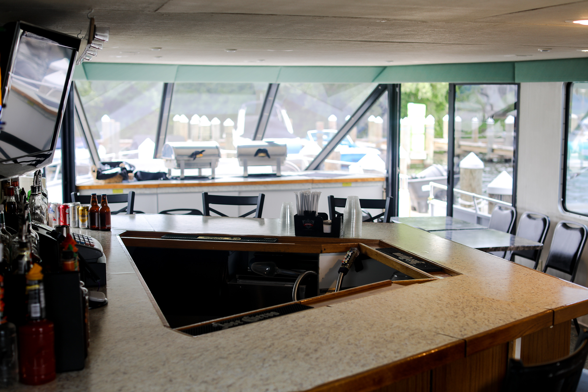a kitchen with a table in front of a window
